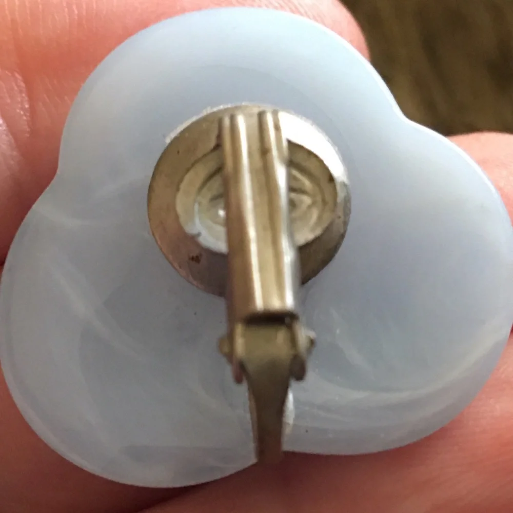 Vintage 70s light blue plastic swirl clip earrings